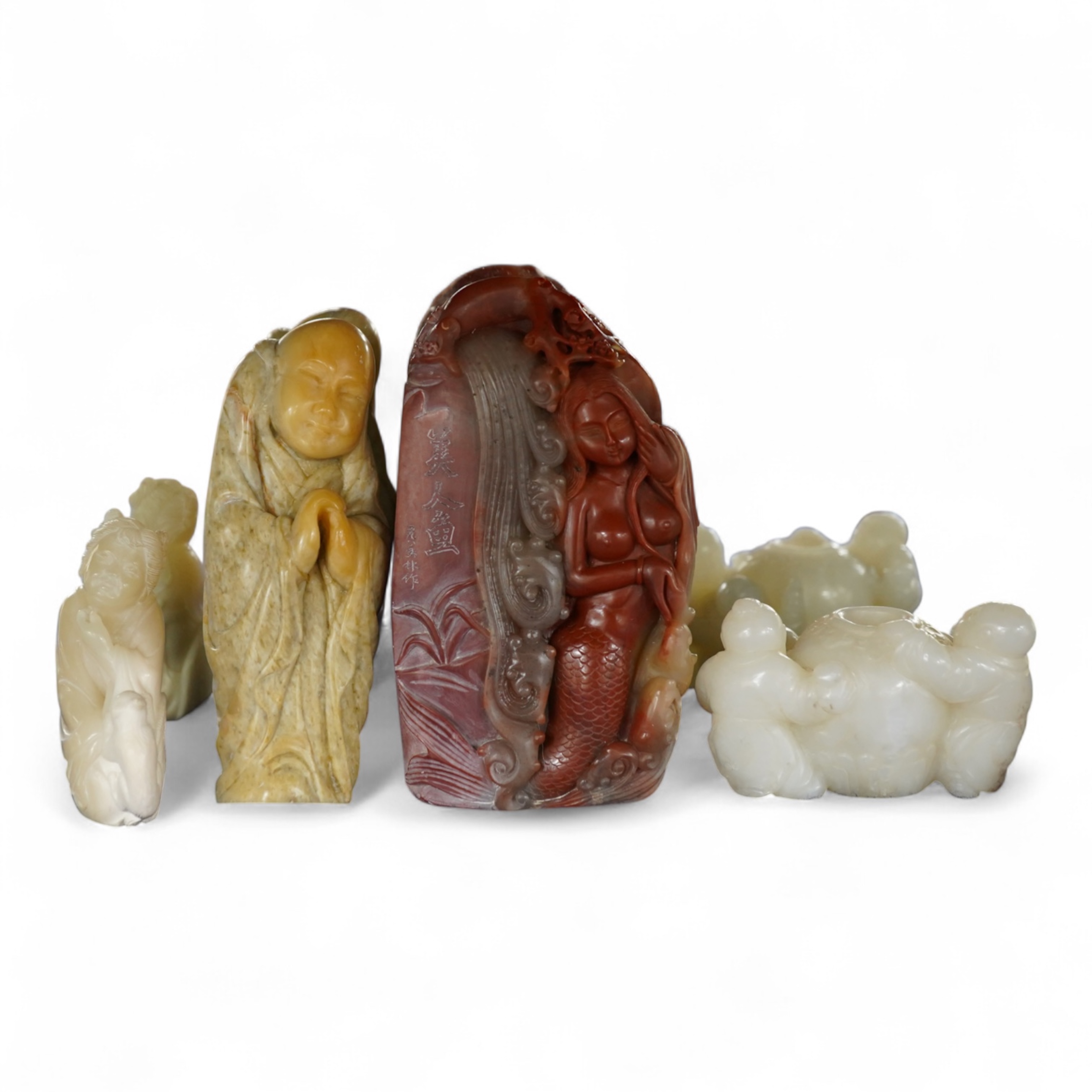 A Chinese white jade 'boys with jar' carving and three shoushan stone figures; luohan, girl with squirrel and mermaid (4), tallest 11cm